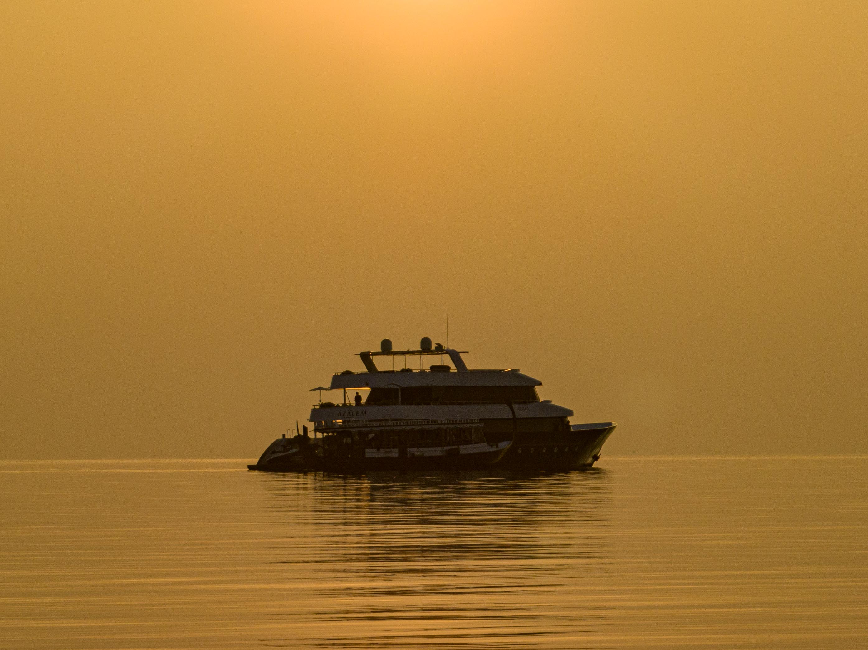 Azalea Cruise sailing through a clear Maldives lagoon
